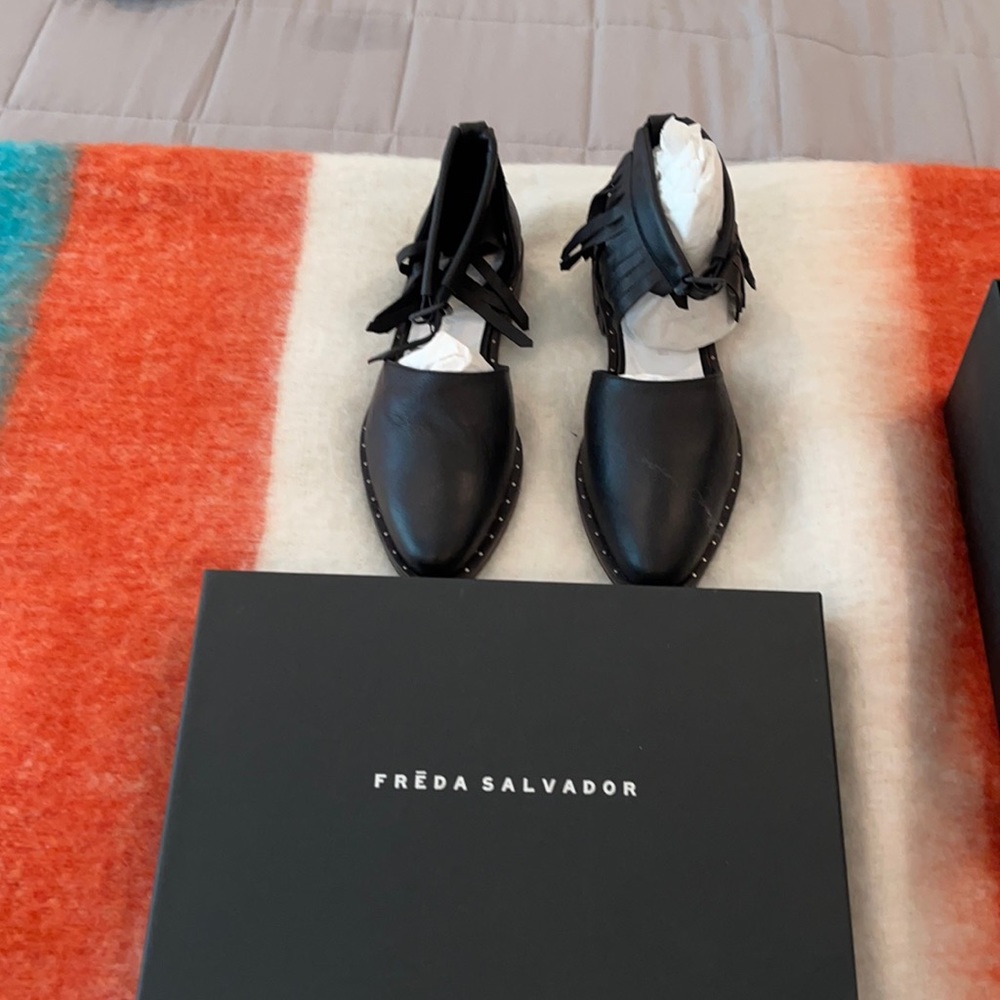 Very cute Freda Salvador ankle fringed flats.